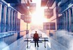 man-standing-desk-servers-city